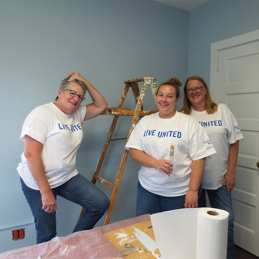 Live United volunteers painting a room